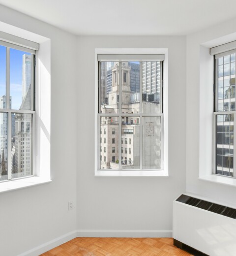 Financial District, NY Apartments Near Battery Park - 63 Wall Street - City Views Through Residence Windows.